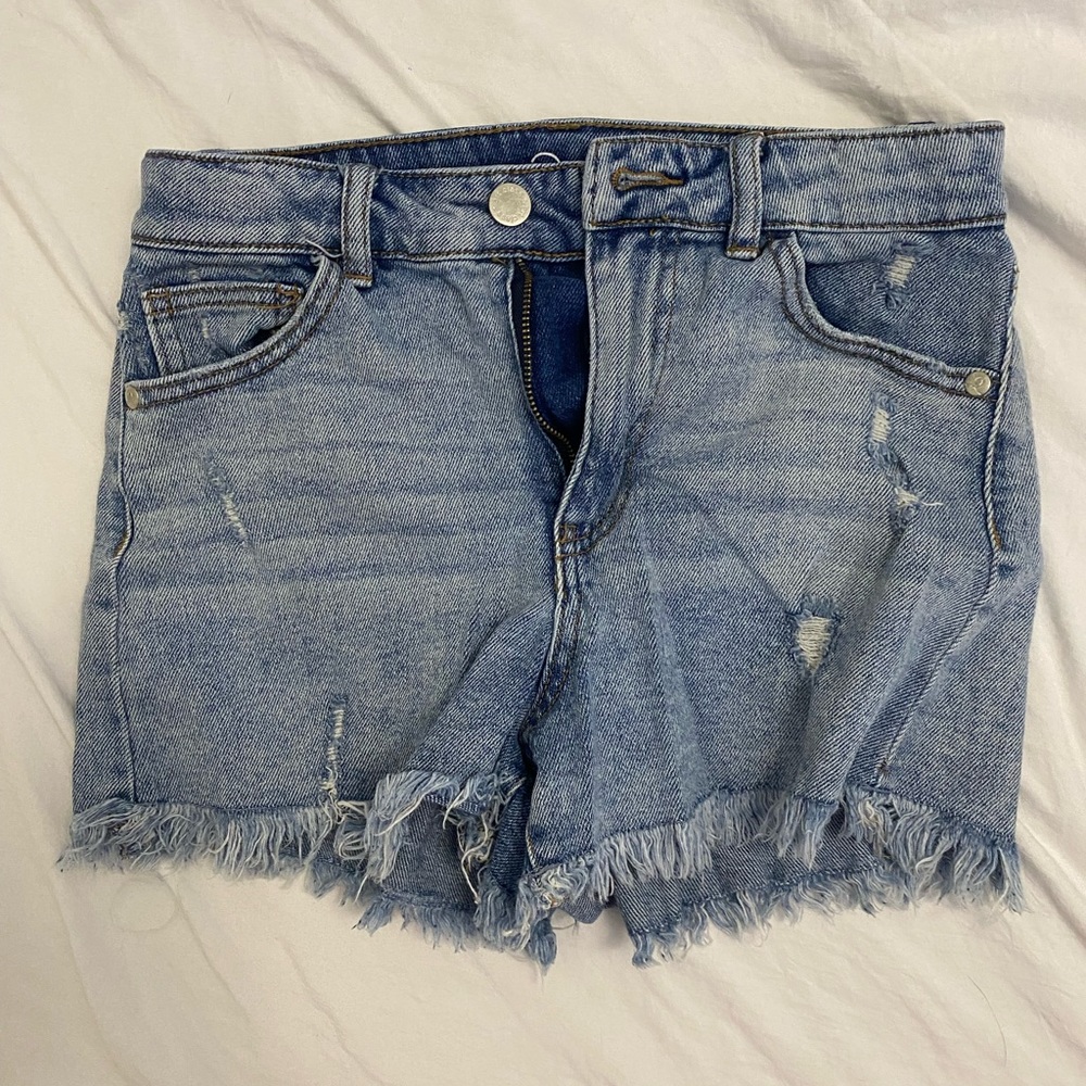 Medium wash short jeans.